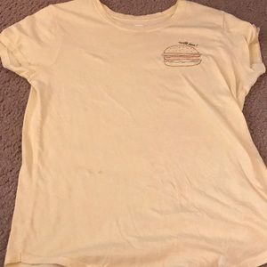 Yellow T-shirt with a hamburger on it